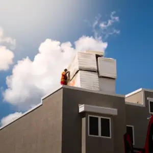 Roofer on top of a commercial building